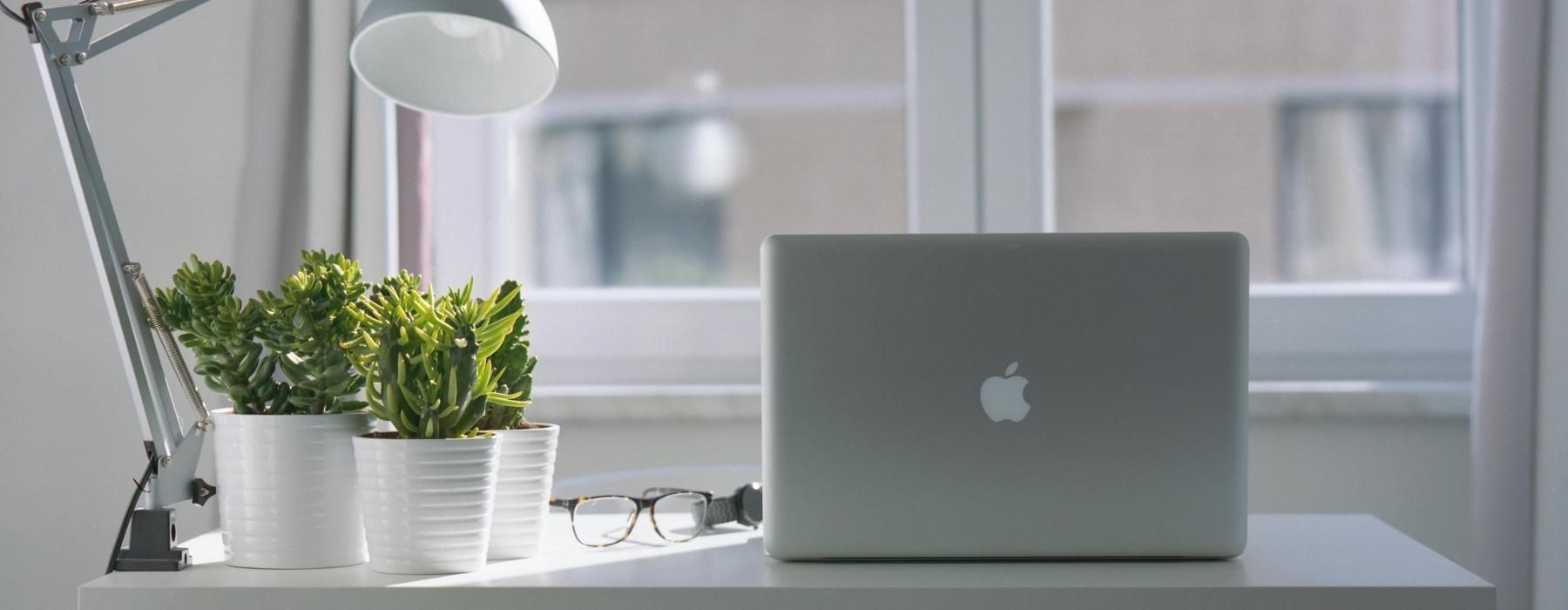 a window and a laptop on a table