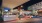 a parking lot with cars at night