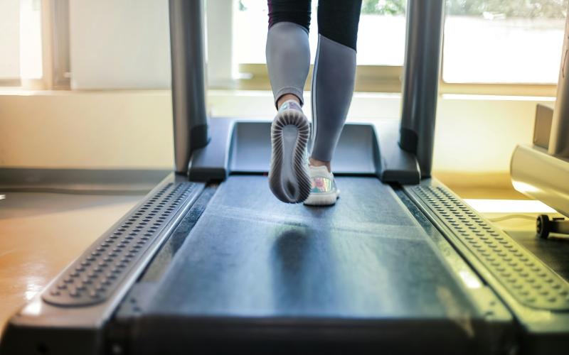 a person's legs on a treadmill