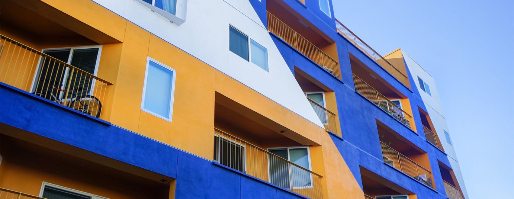 Apartment exterior with colorful paint and balconies