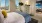a bedroom with a bed and a lamp
