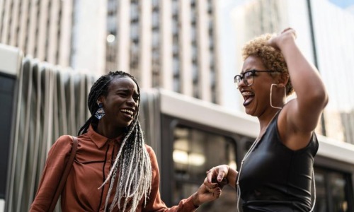 A beautiful community at the heart of all your passions women laughing together in the city